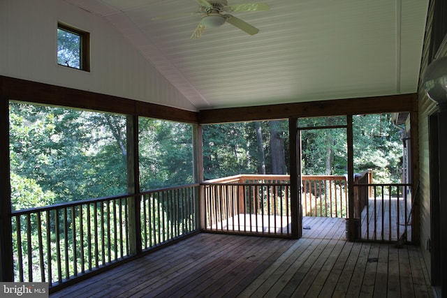 unfurnished sunroom with ceiling fan and lofted ceiling