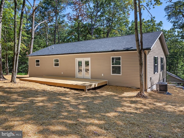 back of house featuring a wooden deck, central AC unit, and french doors