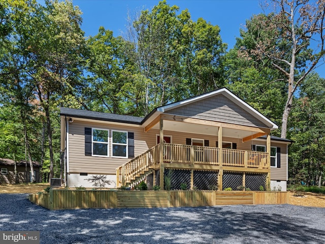 view of front of property featuring central AC and a deck