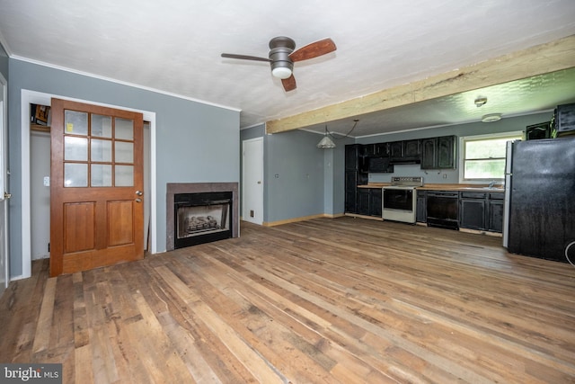 unfurnished living room featuring light hardwood / wood-style floors and ceiling fan