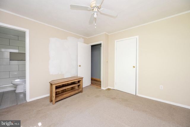 unfurnished bedroom featuring a closet, ceiling fan, ornamental molding, and light colored carpet