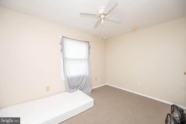 interior space featuring carpet flooring and ceiling fan