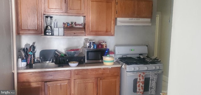 kitchen featuring white gas range