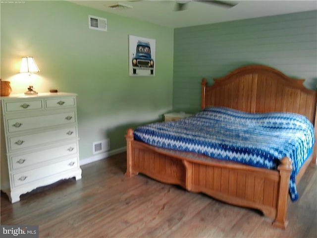 bedroom with ceiling fan and wood-type flooring