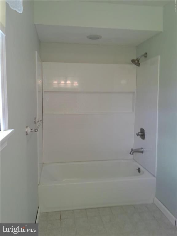 full bath featuring shower / tub combination