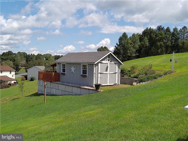 exterior space featuring a yard and a shed