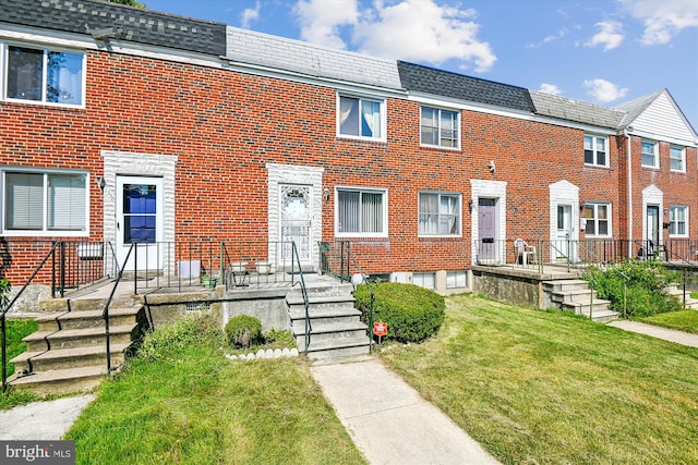 view of property with a front lawn