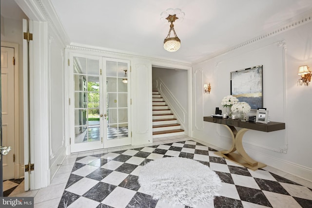 interior space with french doors, light tile patterned flooring, and ornamental molding