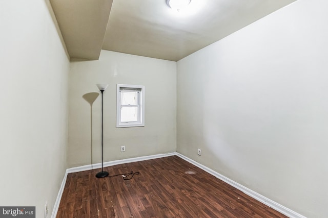 empty room with hardwood / wood-style floors