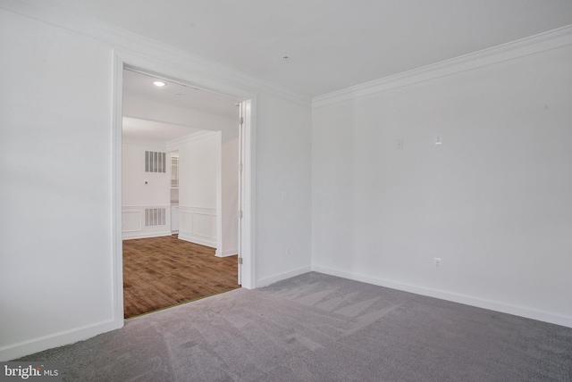 unfurnished room with carpet floors and ornamental molding