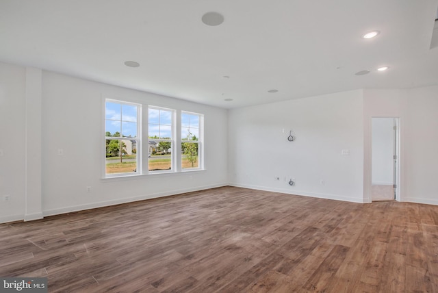 spare room featuring hardwood / wood-style flooring