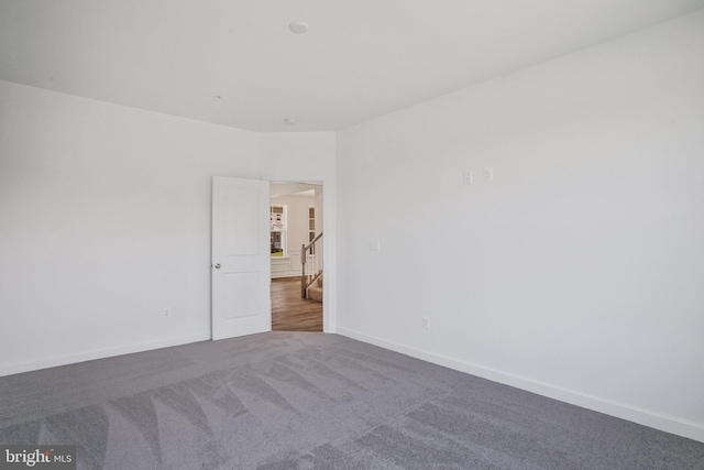 spare room featuring carpet flooring