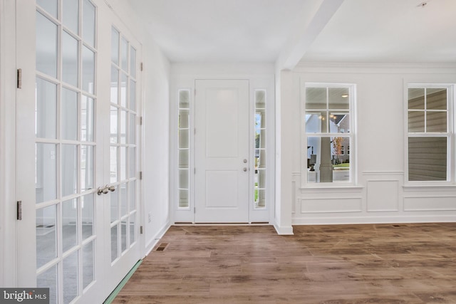 entrance foyer with wood-type flooring and french doors