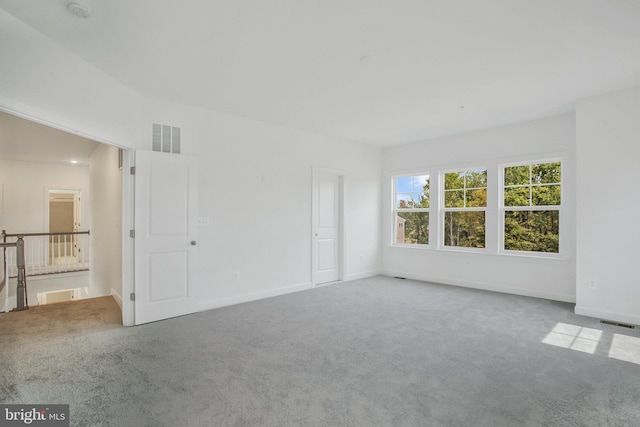 unfurnished room with carpet floors