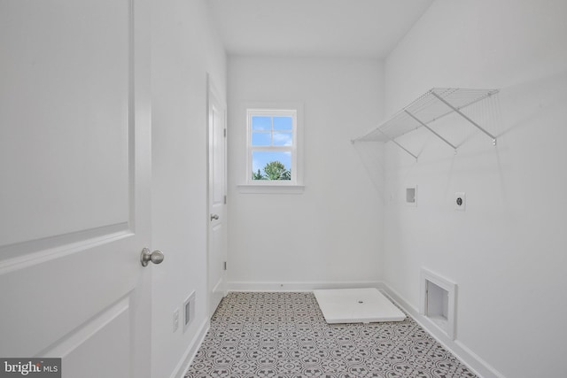 washroom featuring tile patterned floors, washer hookup, and hookup for an electric dryer