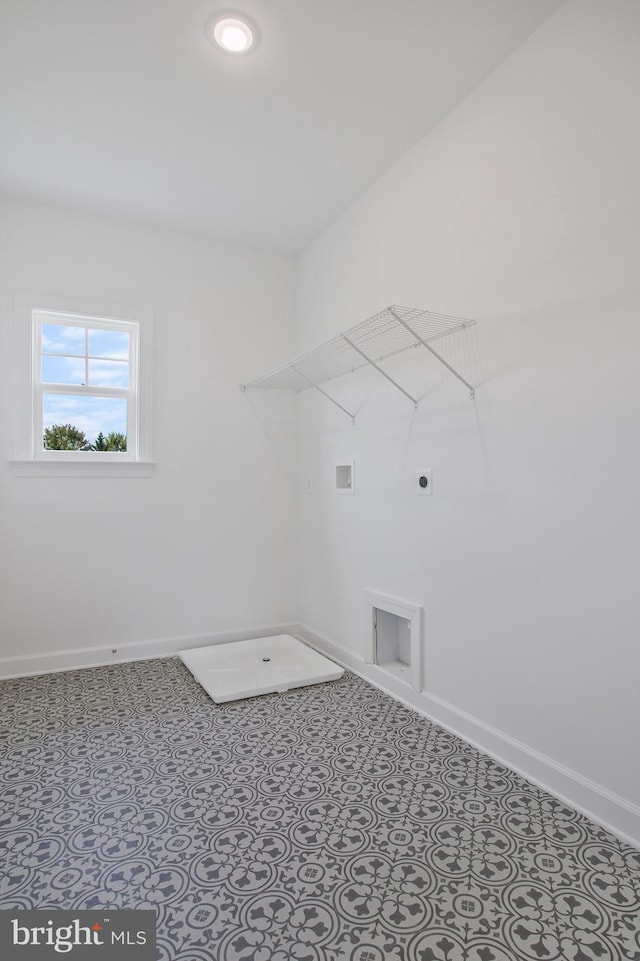 washroom with electric dryer hookup, hookup for a washing machine, and tile patterned floors