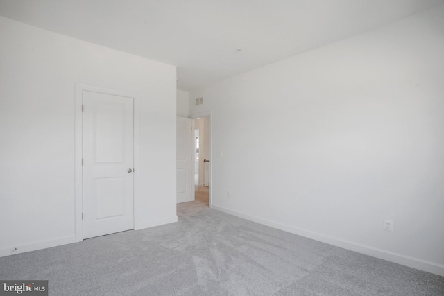 unfurnished bedroom with light colored carpet