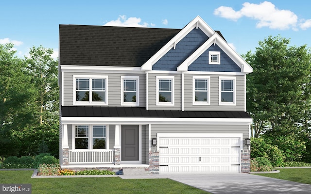 craftsman house featuring a garage and a front lawn