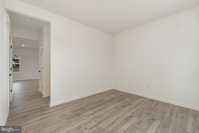 spare room featuring hardwood / wood-style flooring