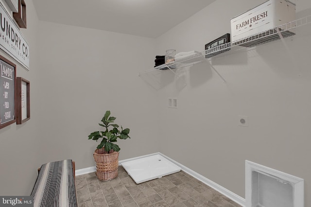 laundry room with laundry area, hookup for a washing machine, baseboards, and electric dryer hookup