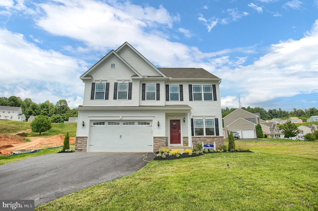 craftsman-style home featuring driveway, stone siding, an attached garage, and a front yard