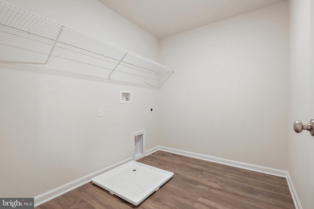 laundry area featuring hookup for a washing machine, hookup for an electric dryer, laundry area, wood finished floors, and baseboards