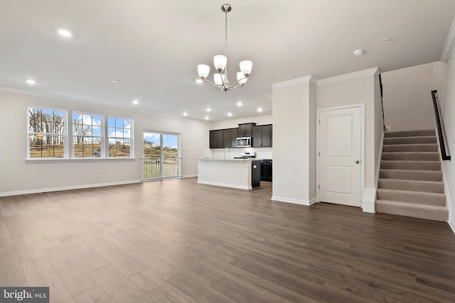 unfurnished living room featuring ornamental molding, dark wood-type flooring, and stairway