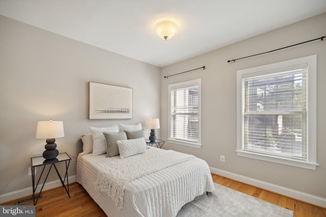 bedroom with wood-type flooring