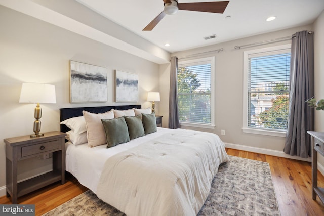 bedroom with light wood-type flooring and ceiling fan