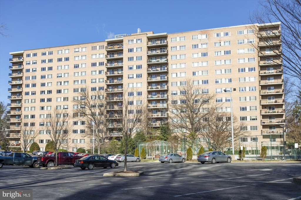 view of property featuring uncovered parking