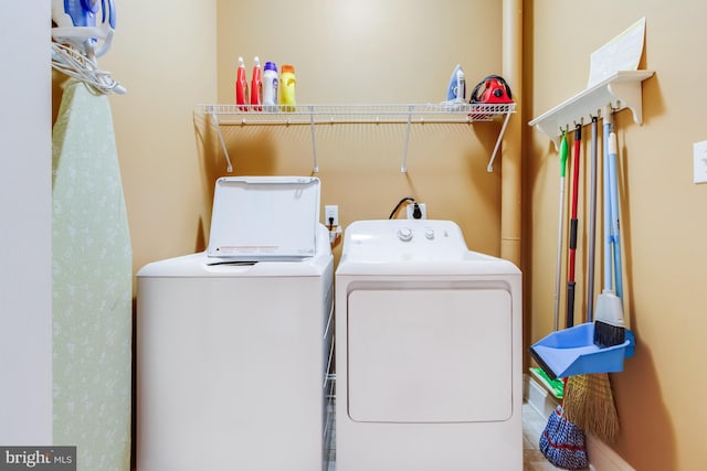 washroom featuring laundry area and washer and clothes dryer