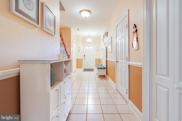 bathroom with tile patterned flooring and baseboards