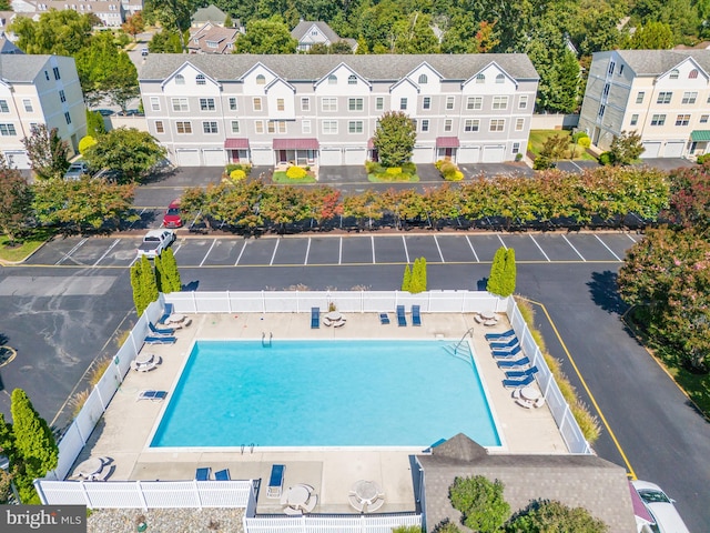 birds eye view of property with a residential view