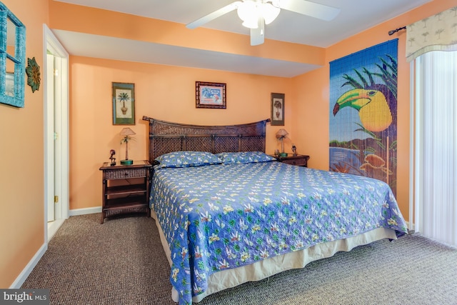 bedroom featuring carpet, baseboards, and a ceiling fan