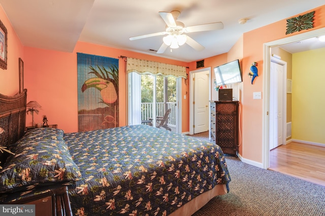 bedroom with carpet floors, a ceiling fan, baseboards, visible vents, and access to exterior