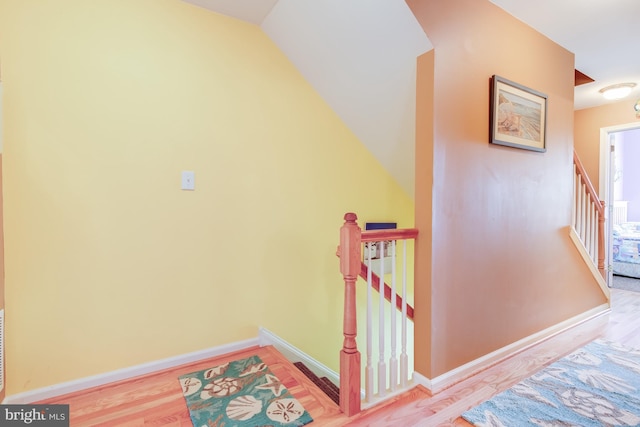 interior space featuring wood finished floors and baseboards