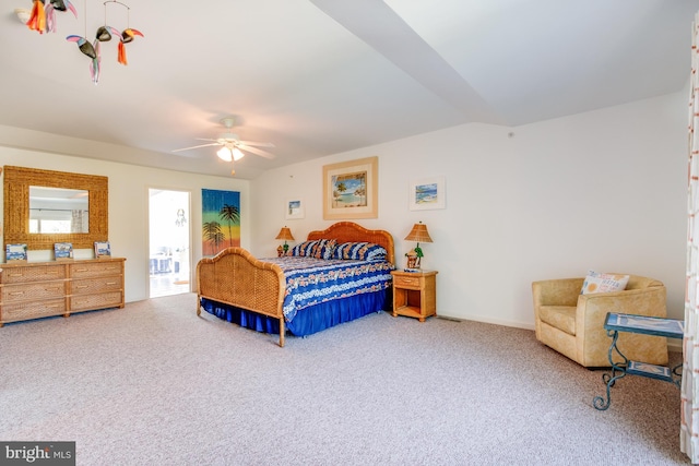 bedroom with vaulted ceiling, ceiling fan, carpet, and baseboards