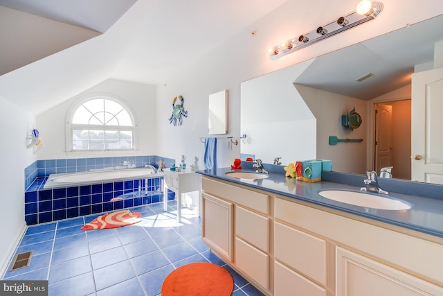 bathroom featuring lofted ceiling, tile patterned flooring, visible vents, and a sink