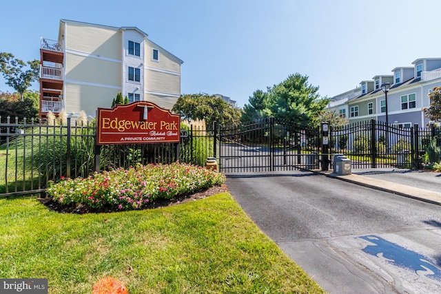 exterior space featuring a yard, fence, and a gate