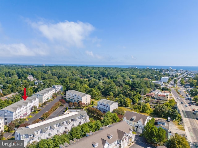 birds eye view of property with a forest view