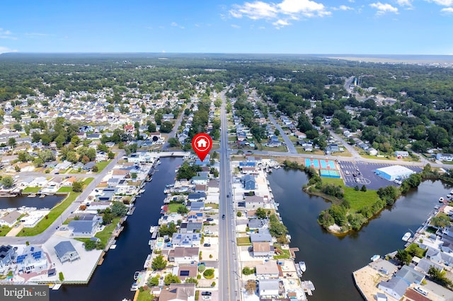 birds eye view of property featuring a residential view and a water view