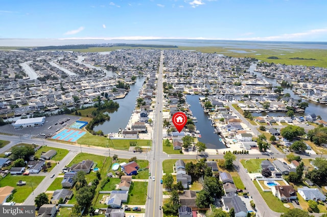 birds eye view of property featuring a residential view and a water view