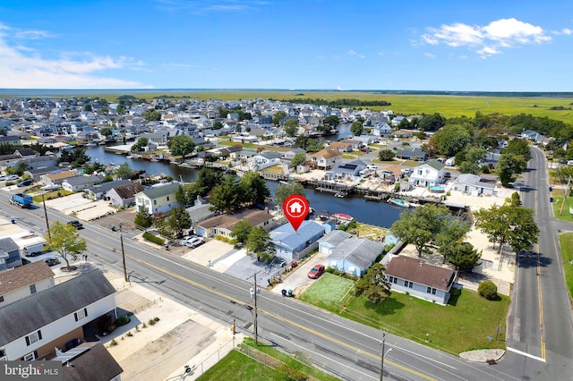 bird's eye view with a residential view and a water view