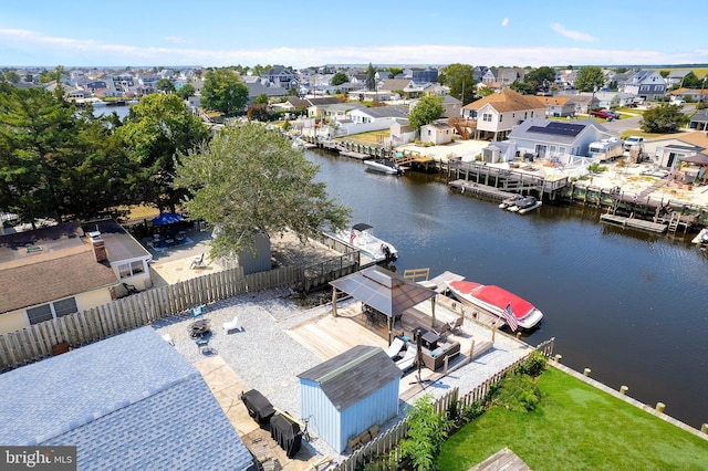 aerial view featuring a residential view and a water view