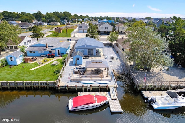 birds eye view of property with a residential view and a water view