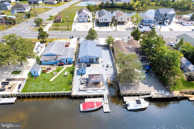 bird's eye view featuring a residential view and a water view