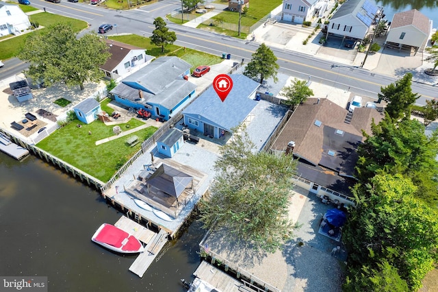 aerial view with a residential view and a water view