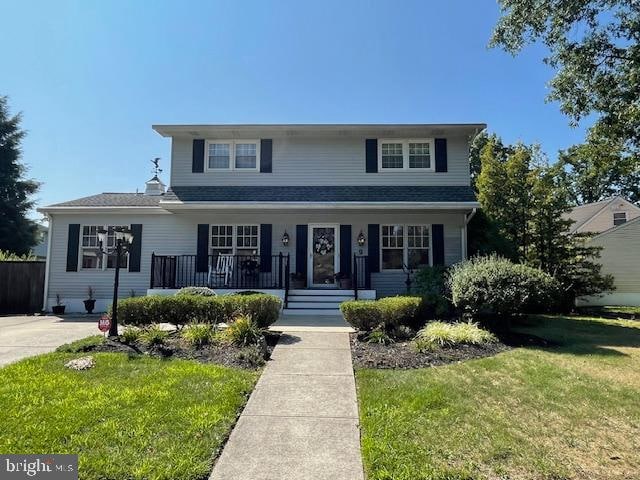 view of front of home with a front lawn and a porch