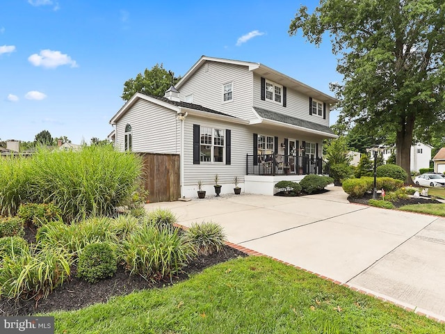 view of front property featuring covered porch