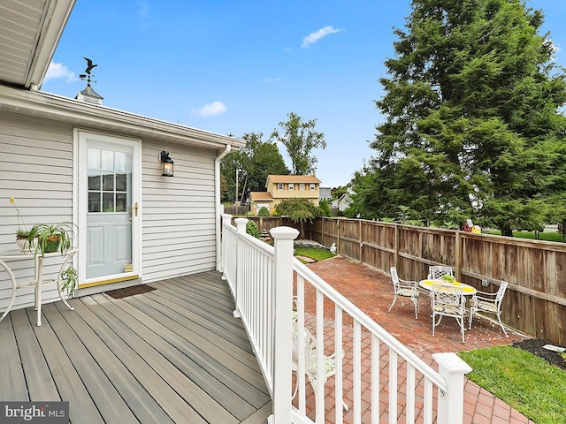 wooden terrace featuring a patio